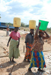Twenty adults carried water needed for the project from the bore hole, including four women.