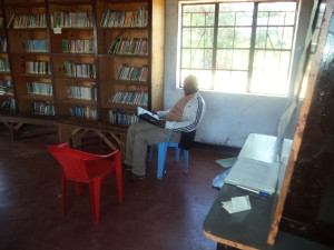 Community Member Reading in the Library