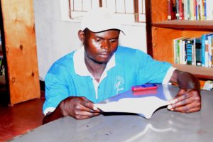 A young man using the Nkhanga Library. December 2015